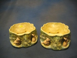 A pair of Sylvac circular pottery planters in the form of tree stumps decorated pixies and rabbits, the bases marked Sylvac 1513 7"