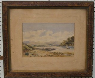 A 19th Century watercolour drawing "Lake with Sailing Boat, Figure on Shore and Mountain in Distance" 7" x 10" in an oak frame