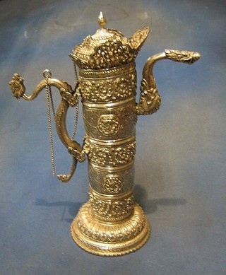 A large and impressive Eastern embossed and engraved silver coffee pot with dragon handle 14", 43 ozs