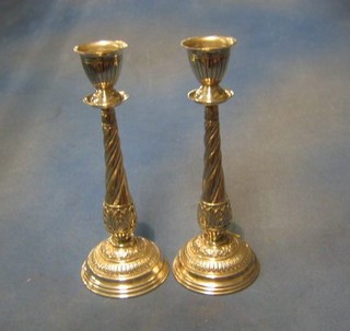 A pair of Eastern embossed silver spiral candlesticks 12" 22 ozs