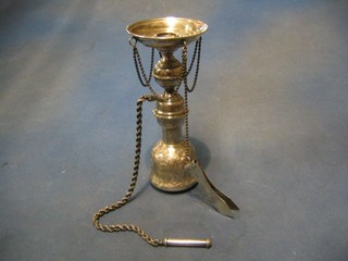 An Eastern embossed silver incense stand, hung chain and with 2 implements 12 ozs