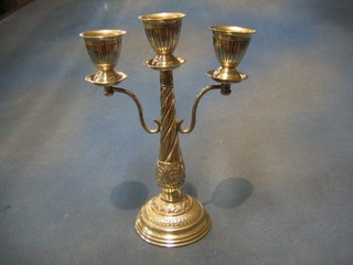 An Eastern embossed and engraved silver 3 light candelabrum 11", 18 ozs