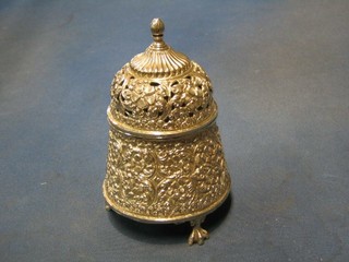 A circular Eastern embossed pierced silver incense burner, raised on 3 paw supports 6 1/2", 13 ozs