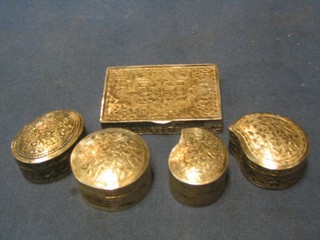 A rectangular Eastern embossed silver trinket box with hinged lid 2", a circular ditto 1", 2 tear drop shaped boxes 1" and 1 1/2" and an oval ditto 3"