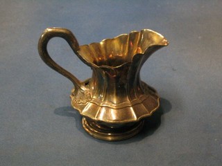 A Victorian embossed silver plated cream jug