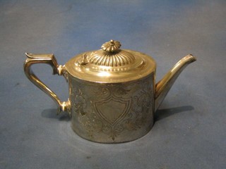 An oval and engraved silver Britannia metal teapot