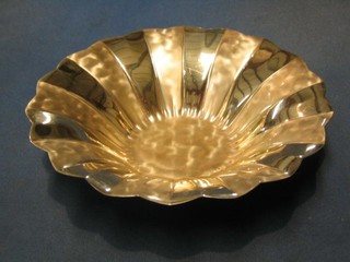 A modern WMF silver plated bowl of circular faceted form, raised on 3 bun feet, the base marked WMF Ikora Germany 9"