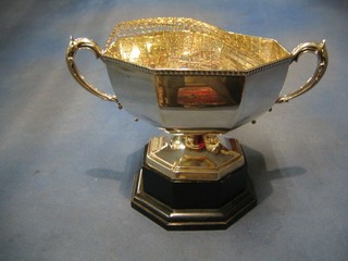 A silver poly-octagonal twin handled trophy, engraved Presented by the Grey Hound Racing Association Ltd White City Stadium,   Birmingham 1933, 32 ozs