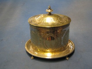 An oval engraved silver plated biscuit barrel with hinged lid 7 1/2"