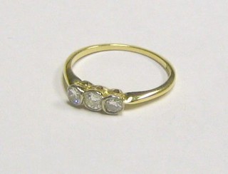 A lady's 18ct gold dress ring set 3 diamonds