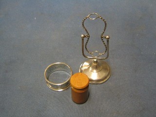 A silver egg timer frame, a silver napkin ring and a cylindrical treen box 2"