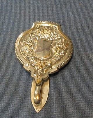 An embossed silver plated watch hanger