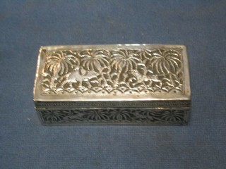 A rectangular Eastern embossed silver box with hinged lid decorated elephant and tiger 4"