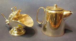 A silver plated hotelware hot water jug and an engraved silver plated sugar scuttle (2)