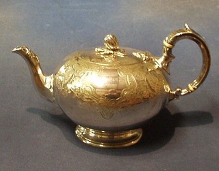 A Victorian engraved silver plated teapot with melon finial