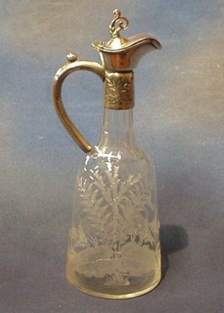 A Victorian etched glass claret jug with Britannia metal mounts