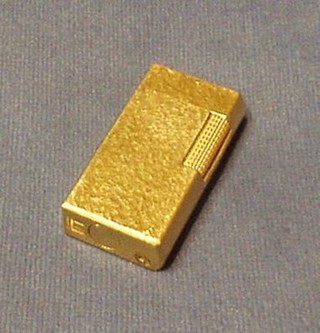 A Dunhill barked gold plated gas lighter, marked Dunhill 70