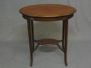 An Edwardian oval inlaid mahogany 2 tier occasional table raised on outswept supports 26"