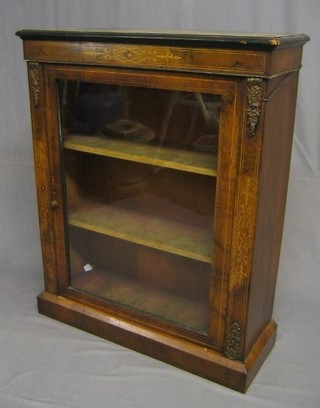 A Victorian inlaid walnutwood pier cabinet, the interior fitted adjustable shelves enclosed by glazed panelled doors with gilt metal mounts 31"