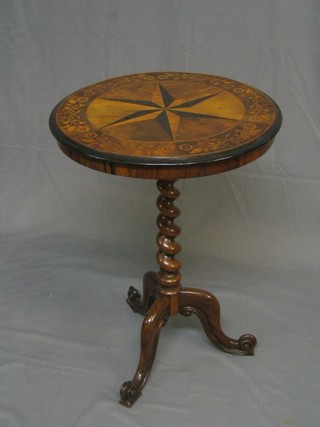 A handsome Victorian circular inlaid walnutwood wine table, the top inlaid and ebony and satinwood star within a floral crossband, raised on spiral turned supports with tripod base, 20"