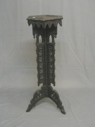 A 19th Century carved Eastern hardwood octagonal jardiniere stand, raised on pierced supports 13"