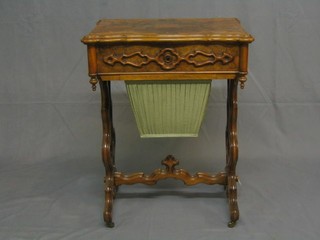 A handsome Victorian figured walnutwood work box of serpentine outline, fitted a deep basket, raised on pierced shaped supports with H framed stretcher 21"