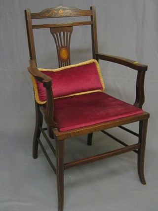 An Edwardian inlaid mahogany open arm chair with upholstered seat, on splayed supports