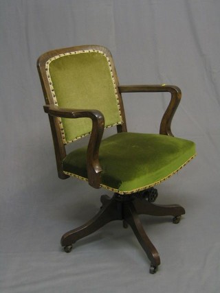 An oak revolving office chair
