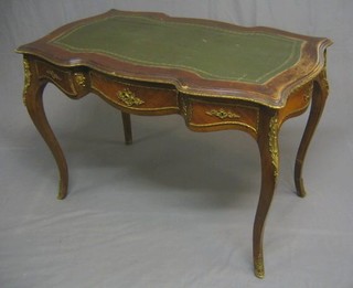 A 19th/20th Century French Kingwood bureau platt of serpentine outline with inset tooled leather writing surface, the apron fitted 1 long and 2 short drawers, raised on cabriole supports with gilt metal mounts throughout 42"