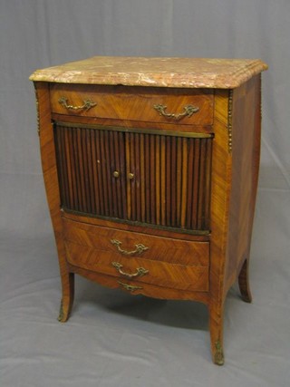 A 19th Century French Kingwood commode with pink veined marble top, fitted 1 long drawer with cupboard enclosed by a tambour shutter, the base fitted 2 long drawers, raised on French cabriole supports with gilt metal mounts 24"