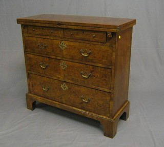A Queen Anne style figured walnutwood bachelors chest with feather banding, fitted 2 short and 3 long drawers, raised on bracket feet 33" (made up)