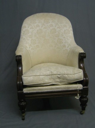 A William IV show frame mahogany tub back chair upholstered white material, on turned and reeded supports