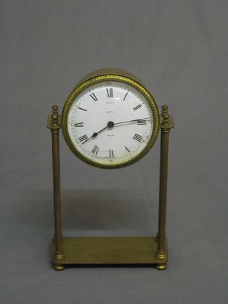 A 1920's French 8 day Portico clock with porcelain dial, Roman numerals contained in a gilt metal case, the dial marked Paris Royal (no pendulum)