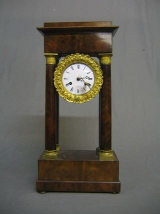 A 19th Century French Portico clock with enamelled dial and Roman numerals, contained in a plain mahogany case with gilt metal capitals (no pendulum and chip to winding hole on dial)