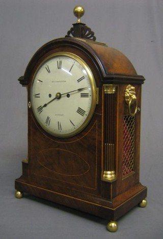 A handsome Georgian double fusee striking bracket clock with 8" painted dial, with Roman numerals marked William Carpenter of London (some pitting to the dial) with 5" rectangular back plate engraved around the edge, the brass pendulum bob engraved a star and contained in an arch shaped inlaid mahogany case surmounted by a brass dome, having 2 reeded and fluted brass inlaid columns to the side, raised on brass caddy feet, 22" (removed from a London property)