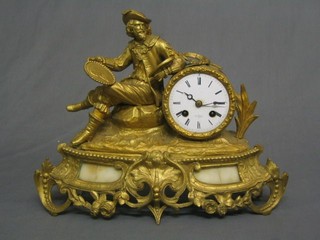 A French 19th Century striking mantel clock with drum movement, having a porcelain dial and contained in a gilt spelter case with a male figure depicting The Arts (requires some attention)