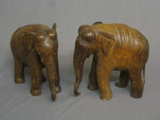 A pair of Eastern carved hardwood figures of elephants 11" 