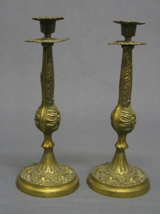 A pair of brass candlesticks 12"