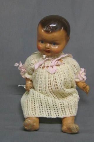 A 1940's doll with composition head and articulated body