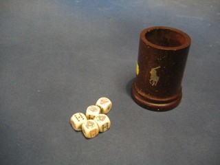 A wooden dice thrower and poker dice