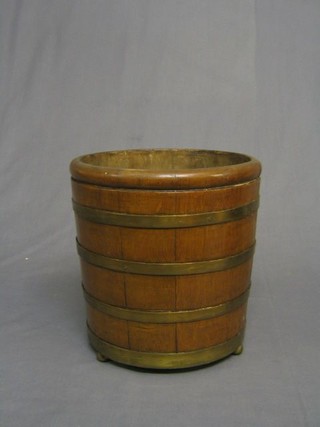 A circular oak coopered jardiniere with metal liner, 12"