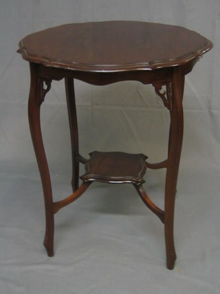 An Edwardian circular mahogany 2 tier occasional table raised on cabriole supports 24"
