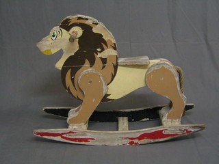 A wooden rocking lion