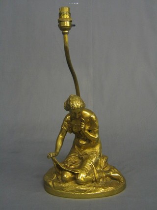 A 19th Century gilt bronze figure of a seated lady with flowers raised on an oval base, converted to an electric table lamp 10"