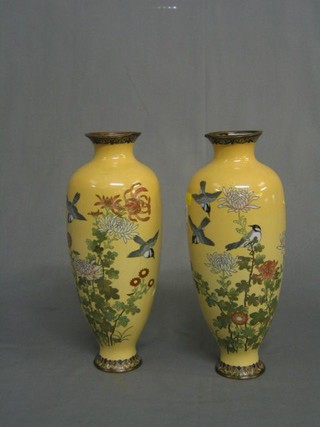 A pair of 19th Century cream ground and floral patterned cloisonne vases decorated birds amidst branches 12" (both f)