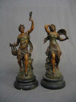 A pair of 19th Century French spelter figures 40" raised on turned socle bases