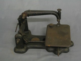 An early small table top mounted sewing machine marked Wheeler & Wilson New York