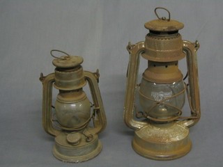 2 old hurricane lamps