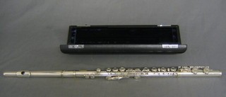 A silver plated flute by Trevor J James of London, marked TJ 10, cased