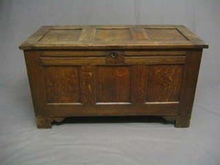 An 18th Century panelled oak coffer with hinged lid  43"
